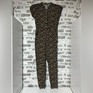 wonder nation Black Floral Smocked Romper with Yellow Accents